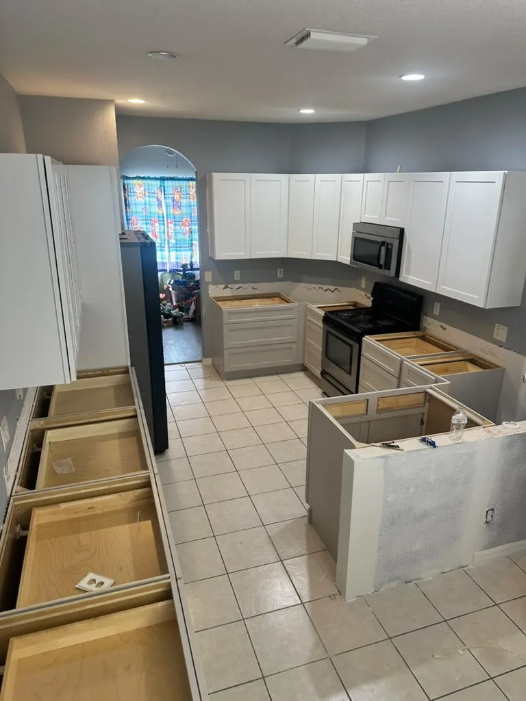 New shaker cabinets being installed before the countertop goes on